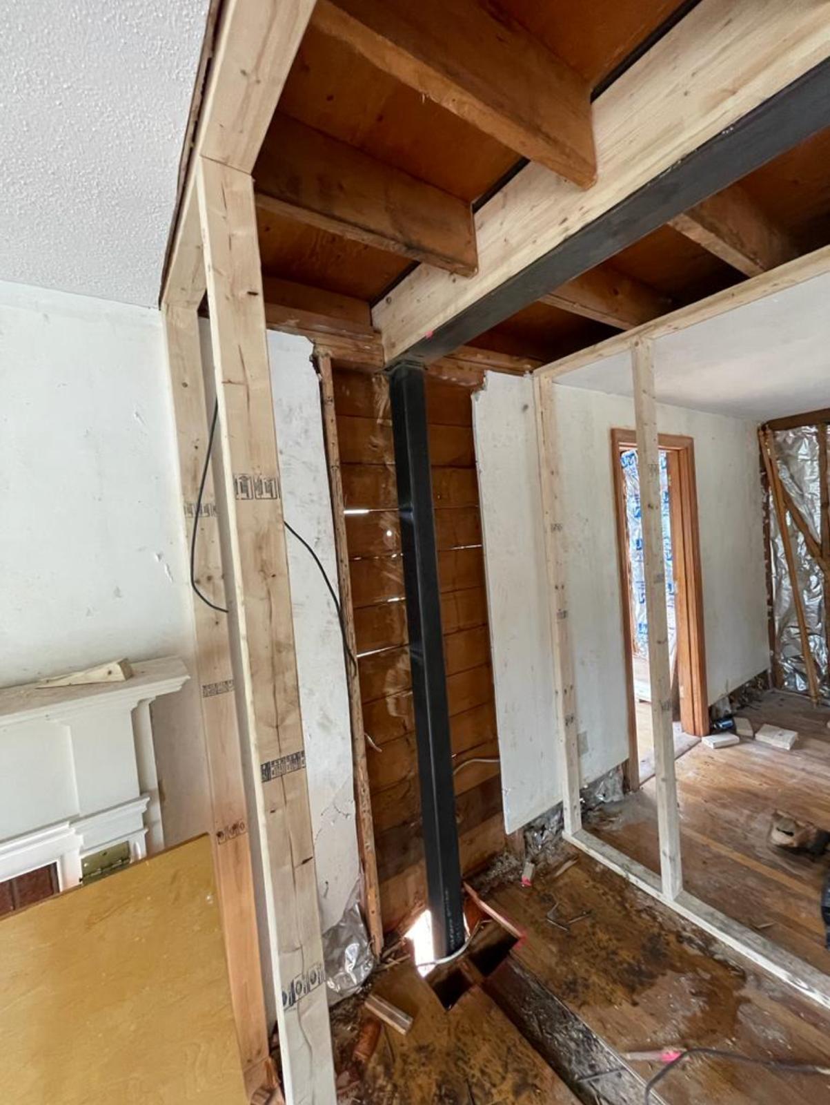 Interior structural steel column supporting a beam